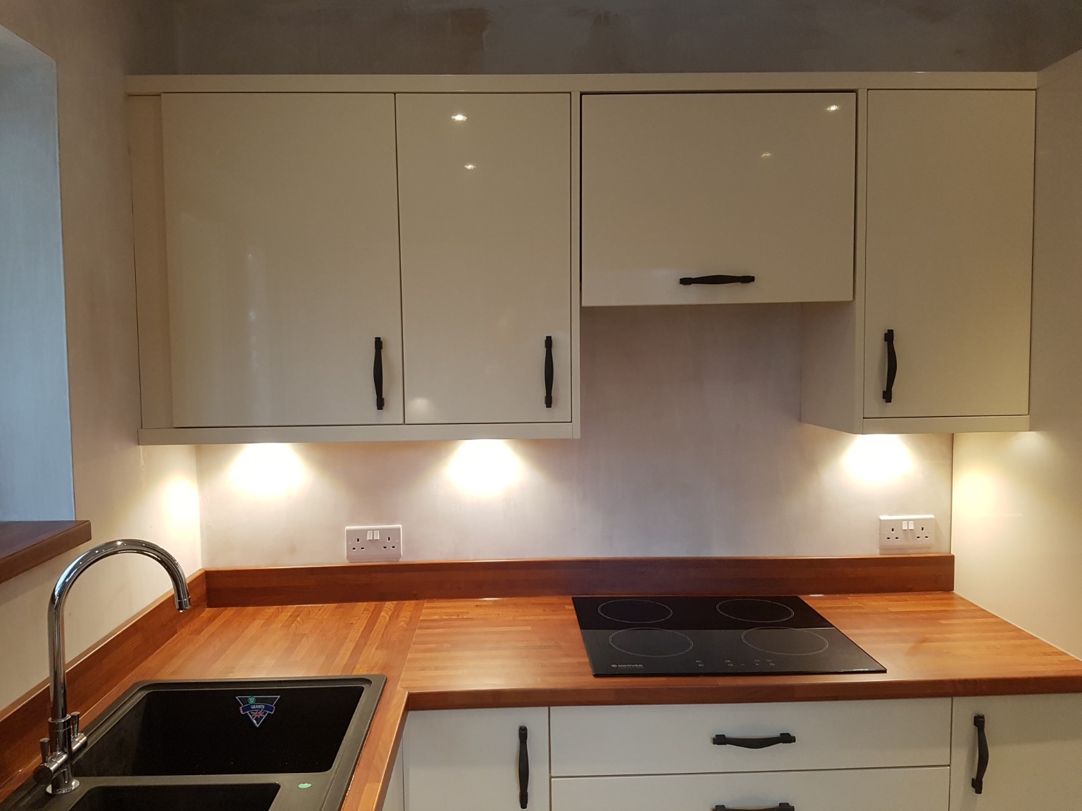 Cabinets and worktops fitted, with room decoration still in progress. Fitted by RCB.