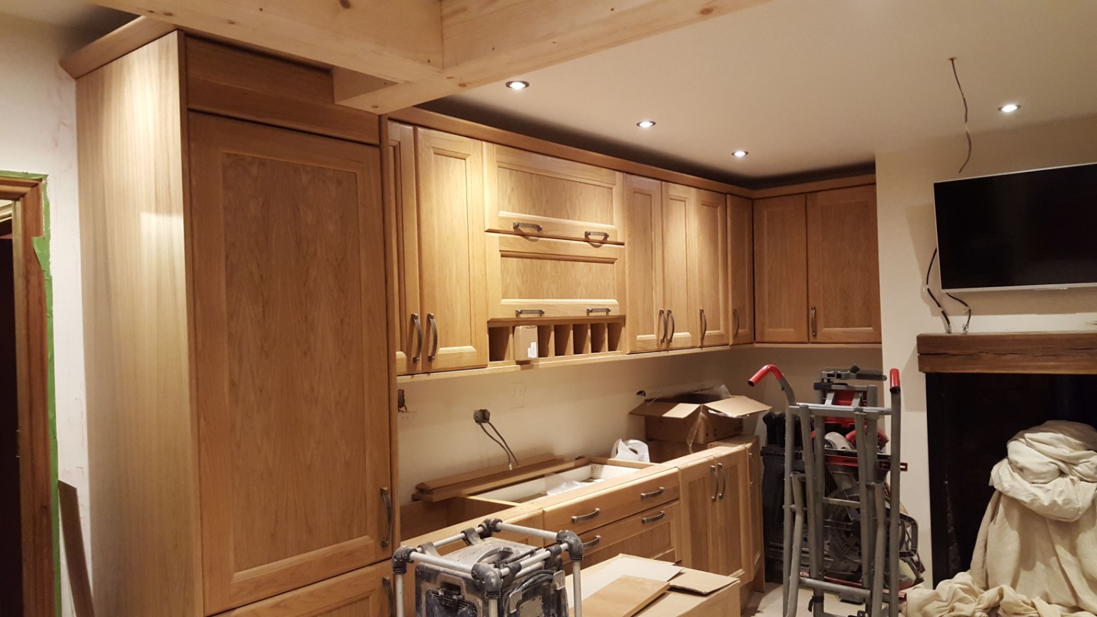 An oak kitchen taking shape during installation. Fitted by RCB.